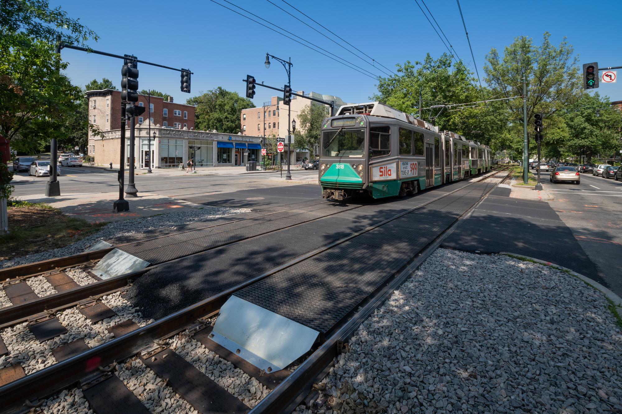 A Green Line train passes over a newly completed intersection upgrade