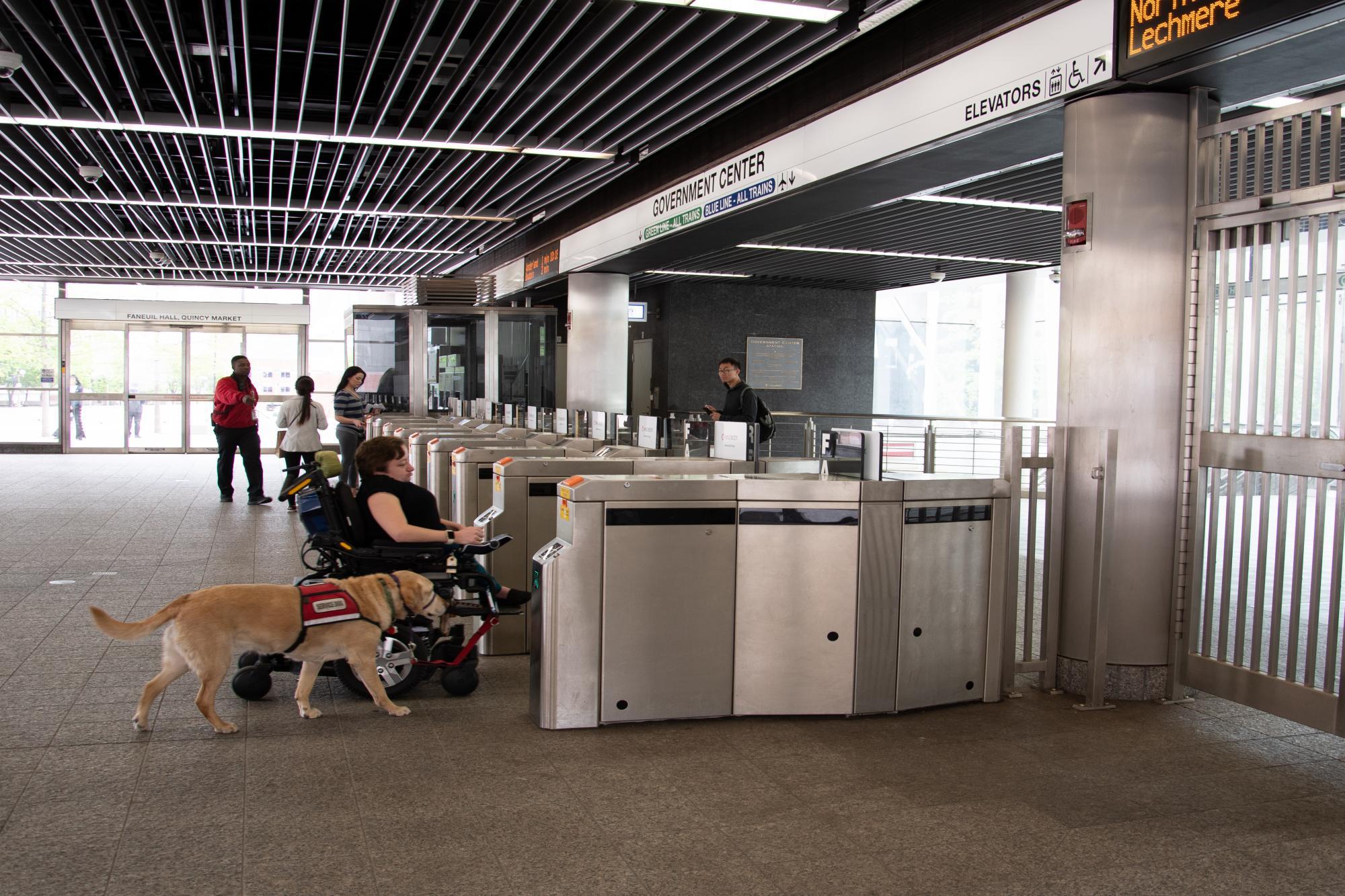 customer entering government center accessible fare gate