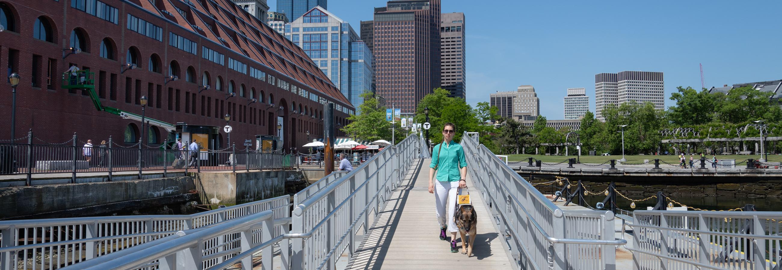 customer entering mbta ferry dock with guide dog