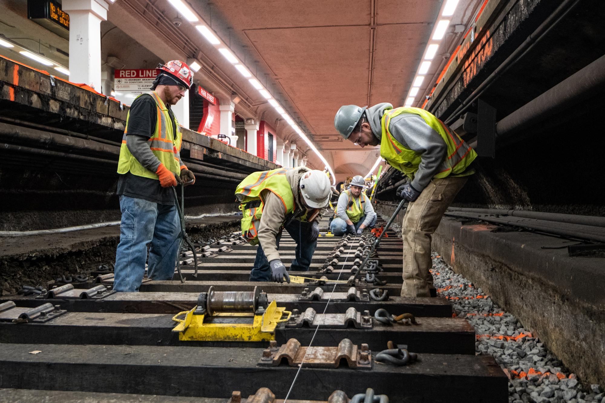 Crew members work on track replacement at Park St during the December 6 – 8, 2019, Red Line weekend shutdown