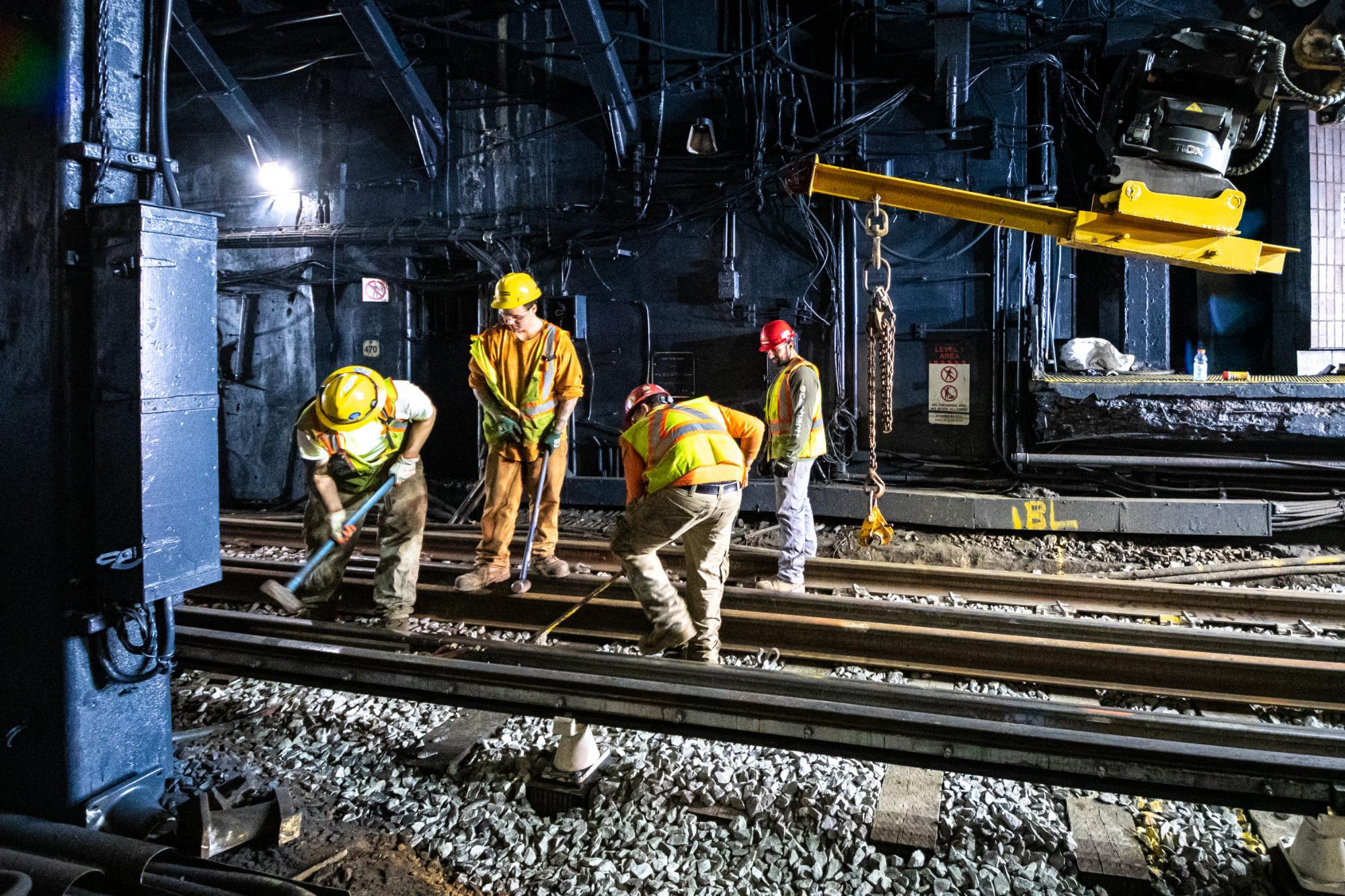 A crew installs continuous welded rail on Haymarket's northbound side during the January 24–26, 2020, weekend shutdown