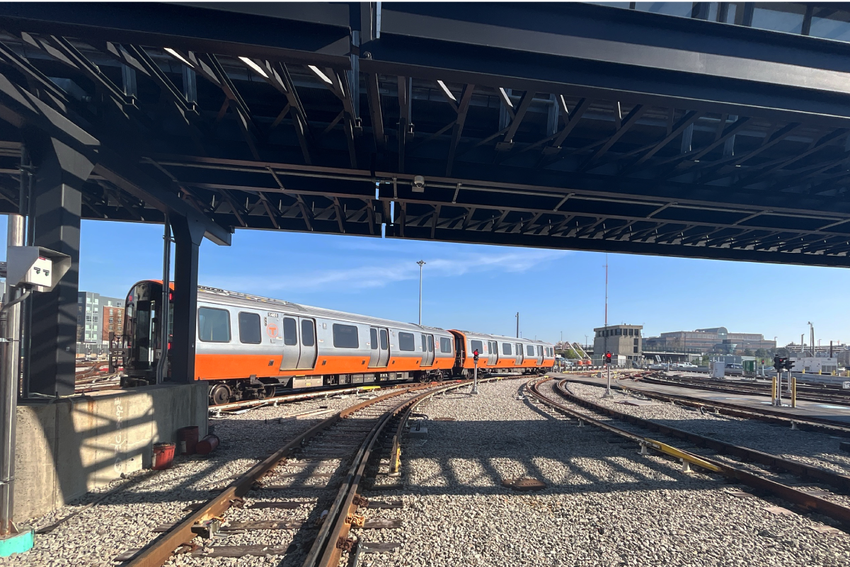an orange line trains outside in yard