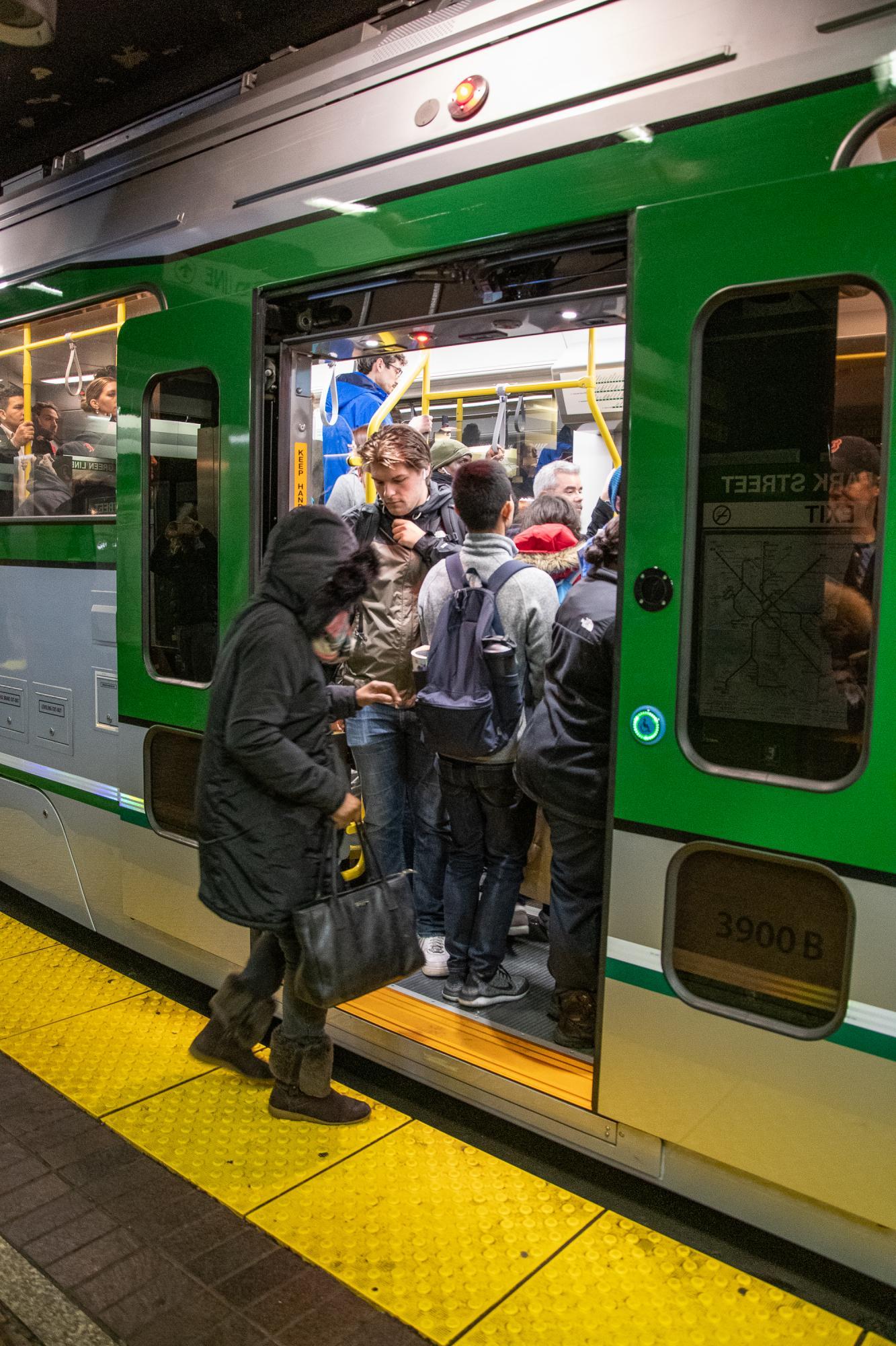 New Green Line Type 9 car at North Station, passengers boarding through the new sliding doors