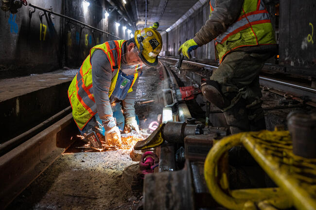 MBTA personnel performing rail work at Tufts Medical Center station