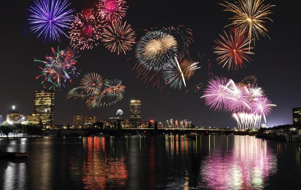 Fireworks display above the Charles River, with the Boston skyline in the background
